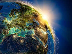 Verbildlichung der digitalen Kommunikation anhand der Darstellung eines Teiles der Erdkugel mit international verlaufenden Netzen. 